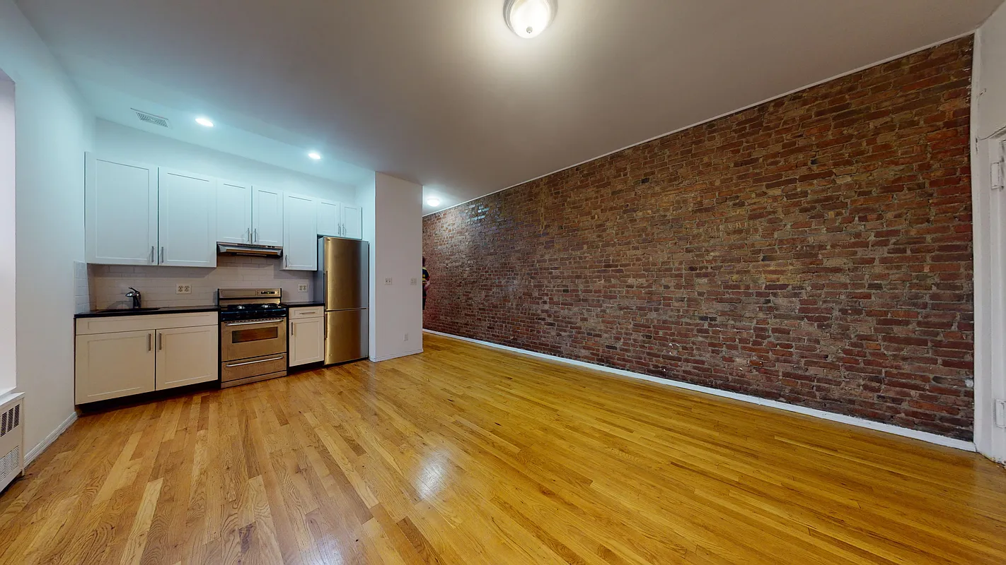 Renovated kitchen and living area at 1297 Lexington Avenue, Apt. 12