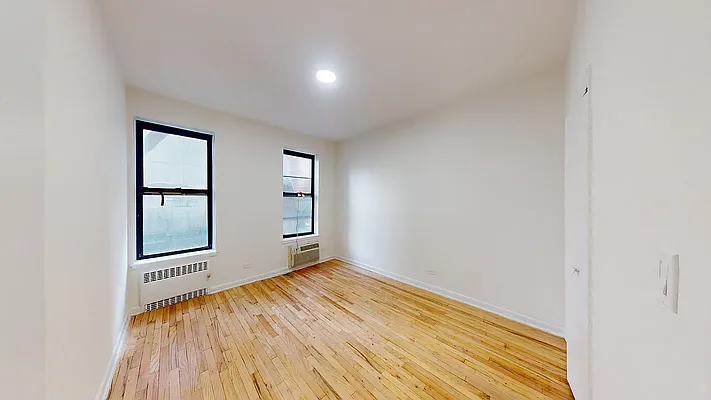 Bright living room at 300½ East 65th Street, Apt. 2D